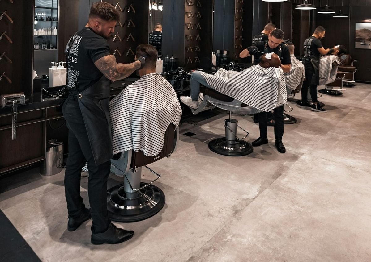 Stylists working with clients in a salon